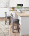 Caitbrook Counter Height Bar Stool - Eclectic 79 Furniture Store